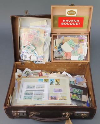 An attache case containing a collection used World stamps