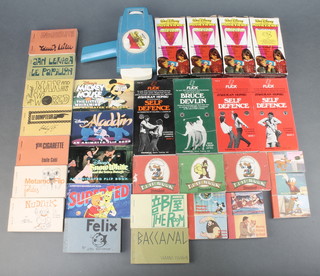 10 French flick cartoon books dated 1967, 13 Walt Disney flick books, a Mettoy Walt Disney movie projector and 4 Super 8 colour cassettes etc 
