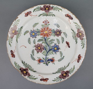 An 18th Century English Delft polychrome dish decorated with stylised flowers 13 1/2" 