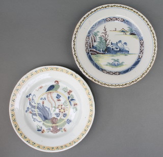 An 18th Century English Delft polychrome plate decorated with a bird sitting on a hoop amongst flowers with a geometric border 9", a polychrome do. with landscape scene and house 9" 