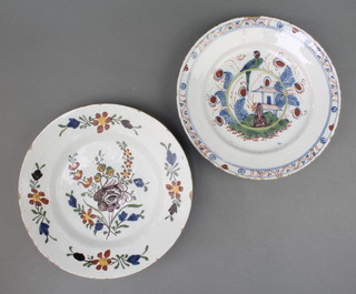 An 18th Century English Delft polychrome plate decorated with a bird sitting on a hoop with building and stylised flowers contained in a geometric border 8 1/2", a do. polychrome Dutch plate decorated with stylised flowers 9" 