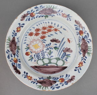 An 18th Century Delft polychrome dish decorated with an insect amongst flowers  within a floral border 14" 