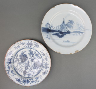 An 18th Century English Delft blue and white plate decorated with a figure in a boat with distant buildings and bridge 8 1/2", a blue and white do. with stylised flowers 7 1/2" 