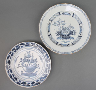 An 18th Century English Delft blue and white plate decorated with flowers 9", a do. decorated with a vase of flowers 7 1/2" 