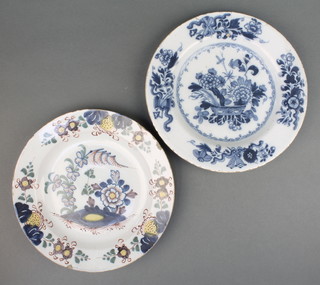 An 18th Century English Delft blue and white plate decorated with a basket of flowers 9", a polychrome ditto decorated with flowers 9" 
