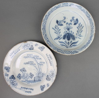 An 18th Century English Delft blue and white plate decorated with a garden view enclosed within flowers 9", a ditto dish decorated with flowers 9" 