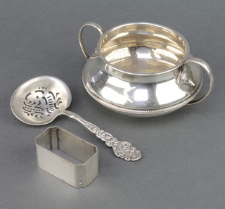 A stylish silver 2 handled bowl Birmingham 1927, a napkin ring and a Sterling silver sifter spoon, 244 grams 