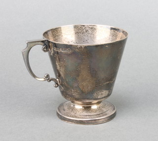 A silver tapered mug with S scroll handle Birmingham 1946 116 grams 