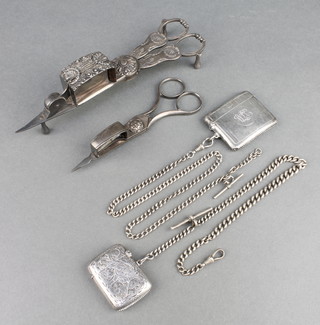 An engine turned silver vesta Birmingham 1919, a do. Albert, 1 other vesta and Albert, 2 candle snuffers