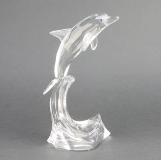 A Swarovski Crystal dolphin on a wave 8" boxed