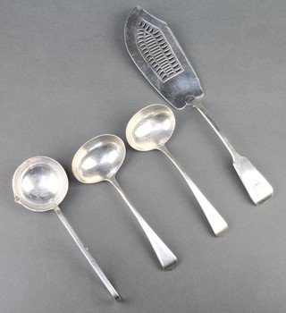 A Georgian silver fish slice, a pair of ladles and a presentation spoon 240 grams 