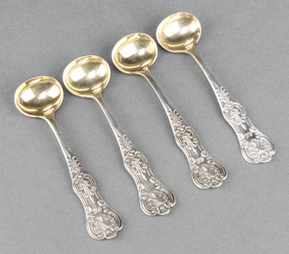 A set of 4 Victorian Scottish silver Kings pattern mustard spoons with gilt bowls Glasgow 1885 86 grams