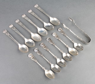 A set of 6 silver commemorative teaspoons Birmingham 1936 together with 6 fancy silver teaspoons and nips with pierced decoration 238 grams 