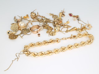 A 9ct yellow gold bracelet and a quantity of gold jewellery including earrings, pendants, etc, 13 grams