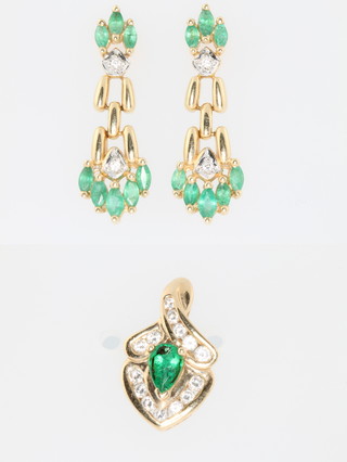 A 14ct yellow gold emerald set pendant and earrings 