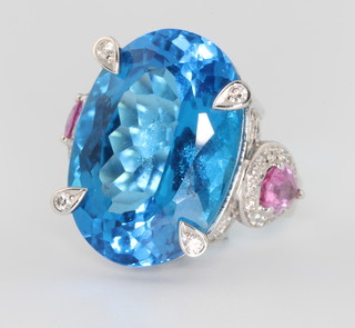 An 18ct white gold oval topaz, pink sapphire and diamond dress ring, the oval centre stone approx. 35ct, size M 