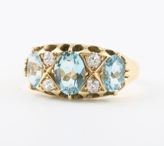 An 18ct yellow gold Victorian style aquamarine and diamond ring, size M 
