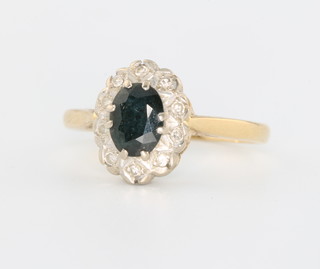An 18ct white gold sapphire and diamond cluster ring size P 