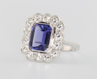 An 18ct white gold tanzanite and diamond ring, the centre stone approx. 3.5ct surrounded by brilliant cut diamonds approx. 1.65ct size N 