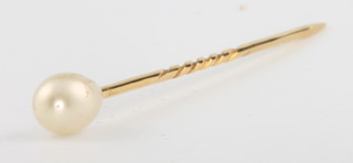 A yellow gold pearl tie pin 