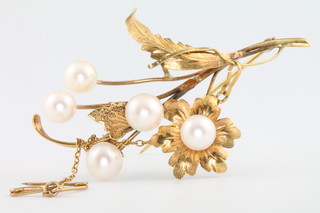A 14ct yellow gold pearl set floral brooch 