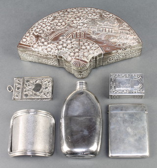 An Edwardian silver card case of plain form Birmingham 1909, a plated buckle, hip flask, stamp box, aide memoir and antimony box 