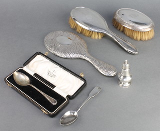 A silver teaspoon in a presentation case, 3 silver backed brushes and mirrors, a teaspoon and pepper