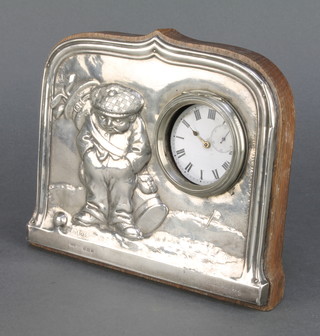 An Edwardian repousse silver watch holder decorated with a golfer 5 1/2" 