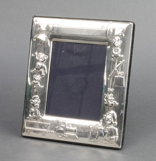 A childs repousse silver photograph frame 6" x 5 1/2" 


