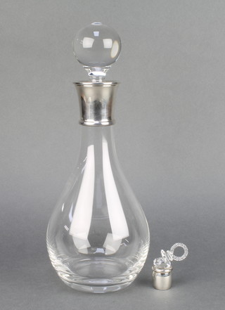 A contemporary baluster decanter with silver collar and a ditto paperweight in the form of a dummy 