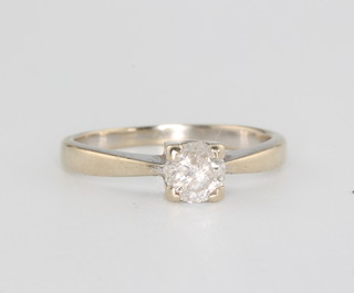 A white gold single stone diamond ring the brilliant cut stone approx 0.5ct, size L, together with a certificate 