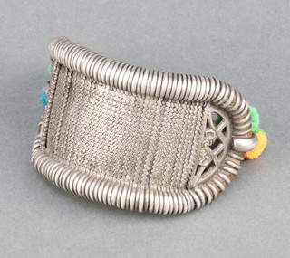 An Indian silver bracelet with wool strap 