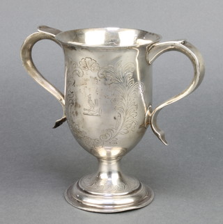 A George III silver 2 handled cup with stylised leaves enclosing an armorial London 1795 6" 290 grams