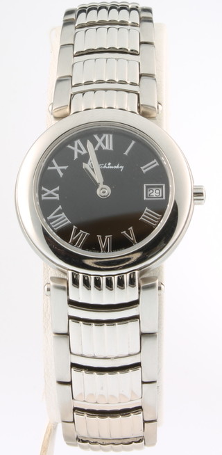 A lady's Kutchinsky stainless steel wristwatch with black dial and calendar movement on a steel bracelet with a quartz movement 