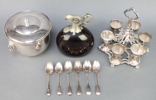 A silver plated ice bucket, a mounted ewer and an egg set 