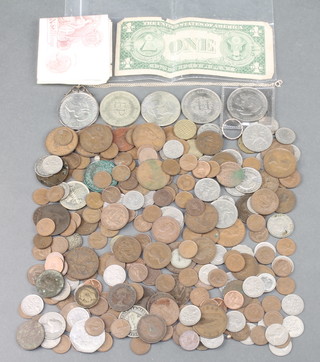 A 1 dollar mounted as a necklace and minor foreign and English coins and bank notes