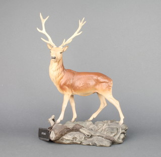 A Beswick matt figure of a stag on a rocky base no.2629 designed by Graham Tongue 13 1/2" 
