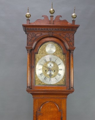 Brown Ferry Fecit, an 18th Century 8 day striking longcase clock, the 12" arched gilt dial with silvered chapter ring, calendar aperture and minute indicator with gilt metal spandrels, complete with pendulum and weights, contained in a carved oak case 86"h 

