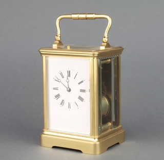 A 19th Century French 8 day repeating carriage timepiece with enamelled dial and gilt metal case, the back plate marked Patent Surety Roller and marked GL 4415, complete with travelling case 5" x 3 1/2" x 3" 