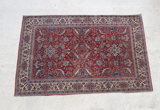 A red and blue ground Persian rug with floral design within multi row border 87" x 36" (no fringing) 