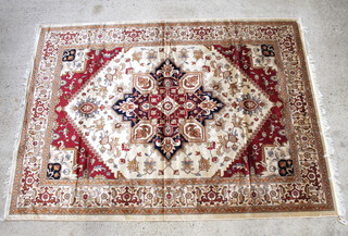 A white and red ground Belgian cotton "Heriz" carpet with central medallion 109" x 79" 