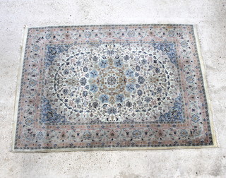 A white and blue ground Tabriz rug with central medallion 84" x 60" 