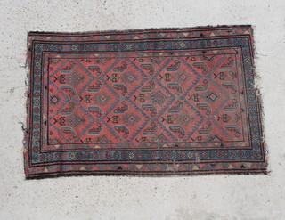 A blue and red Malayer rug with geometric design to the centre within a multi row border 49" x 32"  