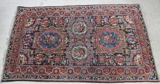 A blue and red ground Bakhtiari carpet 137" x 81" 