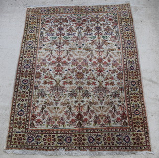 A white ground and floral patterned Tabriz carpet within multi row border 109" x 81"  