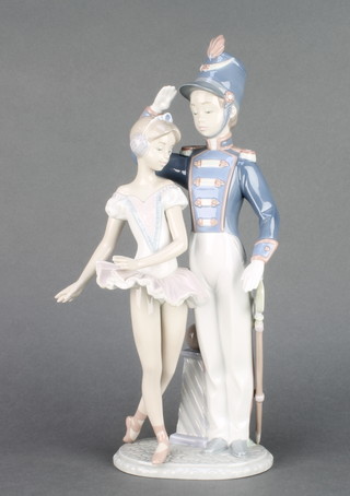 A Lladro group of a boy soldier and a ballerina 5935 12" 