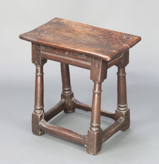 An 18th/19th Century elm joined stool raised on turned and block supports 19"h x 18"w x 11"d 