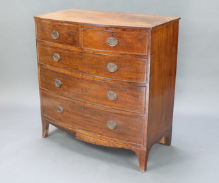A 19th Century bleached mahogany bow front chest of 2 short and 3 long drawers with brass escutcheons and oval drop handles, raised on bracket feet 42"h x 41"w x 22"d 