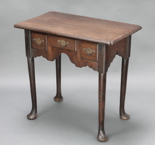 An 18th Century oak low bow fitted 1 long and 2 short drawers, raised on pad feet 27"h x 29 1/2"w x 18"d 