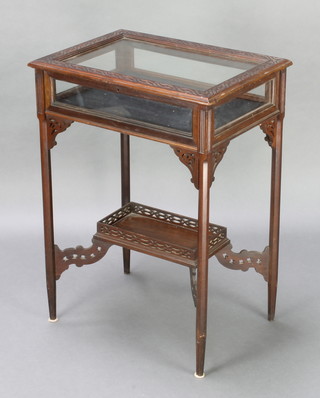 A rectangular Chippendale style mahogany bijouterie table with undertier, raised on square tapered supports with blind fret work decoration 30"h x 22" x 15 1/2" 
